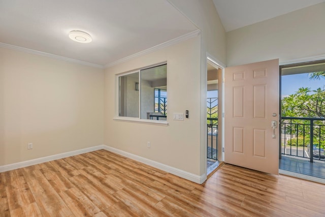 entryway featuring light wood-type flooring and crown molding