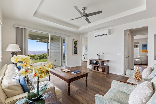 115 Nanu Pl, Wailuku, HI 96793 - living room with an AC wall unit, a tray ceiling, wood finished floors, and ceiling fan
