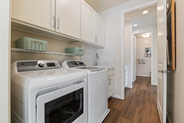 115 Nanu Pl, Wailuku, HI 96793 - laundry area featuring dark wood finished floors, recessed lighting, separate washer and dryer, and cabinet space