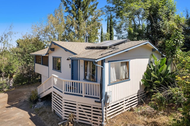 view of front of home featuring solar panels