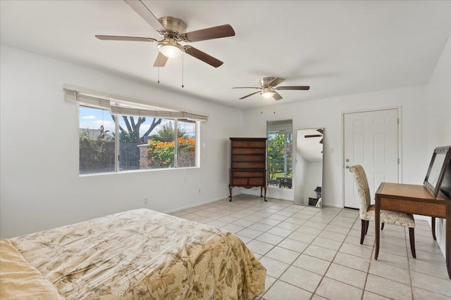 tiled bedroom with ceiling fan