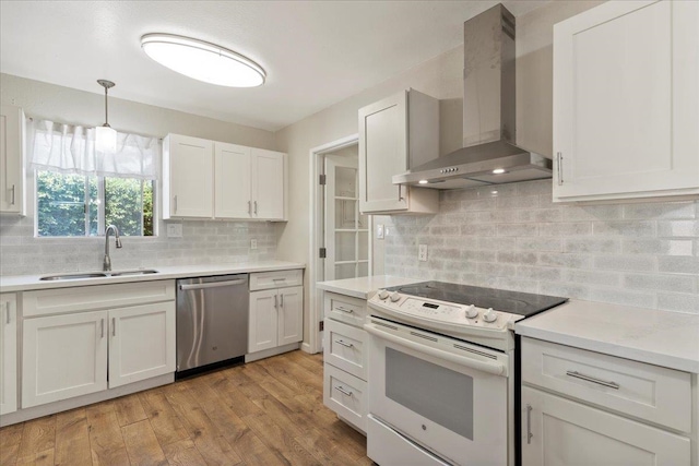 kitchen with white electric range, dishwasher, tasteful backsplash, wall chimney exhaust hood, and sink