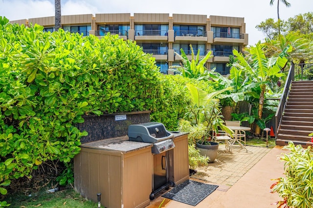 3559 Lower Honoapiilani Rd Unit 720, Lahaina, HI 96761 - view of patio / terrace featuring stairs, an outdoor kitchen, and grilling area