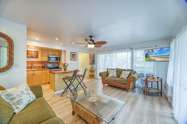3559 Lower Honoapiilani Rd Unit 720, Lahaina, HI 96761 - living area featuring light wood finished floors, ceiling fan, and recessed lighting