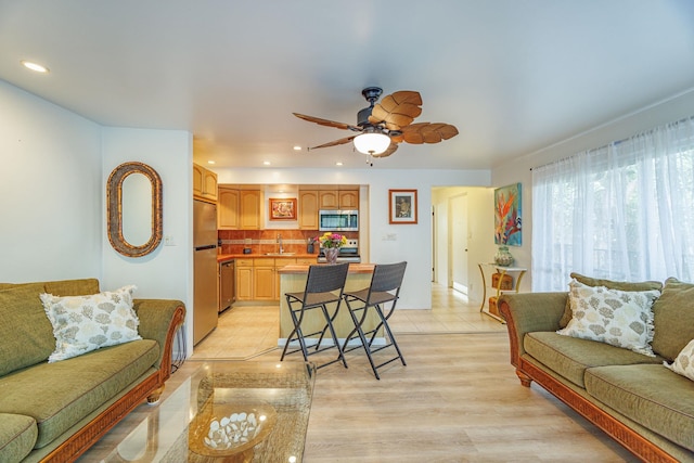 3559 Lower Honoapiilani Rd Unit 720, Lahaina, HI 96761 - living room featuring ceiling fan, recessed lighting, and light wood-style floors