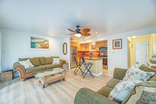 3559 Lower Honoapiilani Rd Unit 720, Lahaina, HI 96761 - living room featuring light wood-style flooring, ceiling fan, and recessed lighting