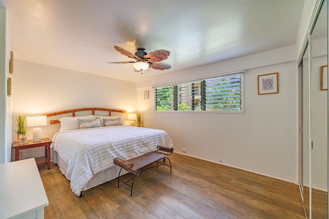 3559 Lower Honoapiilani Rd Unit 720, Lahaina, HI 96761 - bedroom featuring wood finished floors and a ceiling fan