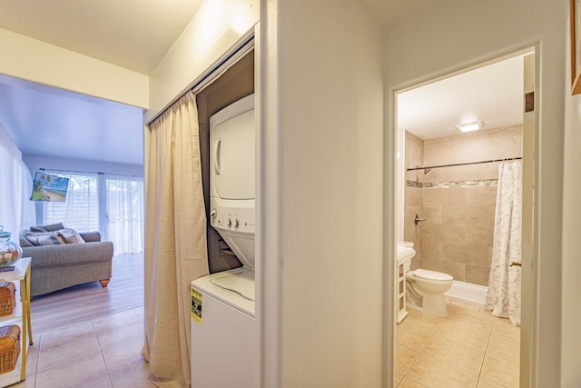 3559 Lower Honoapiilani Rd Unit 720, Lahaina, HI 96761 - laundry area featuring stacked washer and clothes dryer and light tile patterned floors