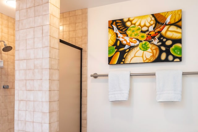 bathroom with tiled shower