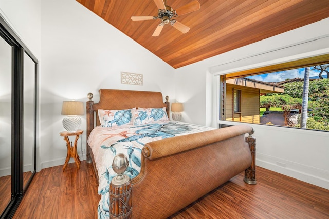 bedroom featuring wood ceiling, a closet, ceiling fan, lofted ceiling, and hardwood / wood-style flooring