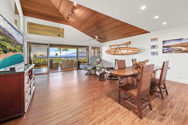 dining space featuring ceiling fan, high vaulted ceiling, wooden ceiling, and light wood-type flooring