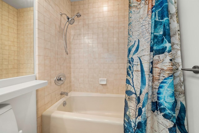 bathroom featuring toilet and shower / tub combo