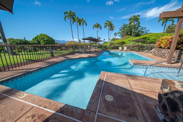 view of swimming pool with a patio area