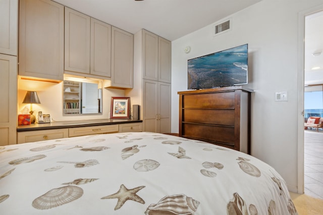 bedroom featuring light tile patterned flooring