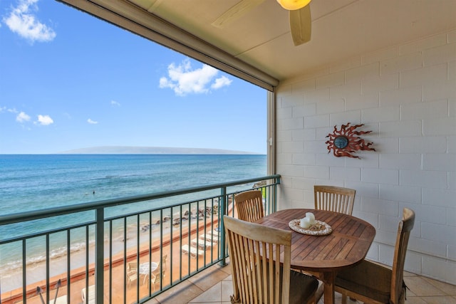 balcony with a water view and a beach view