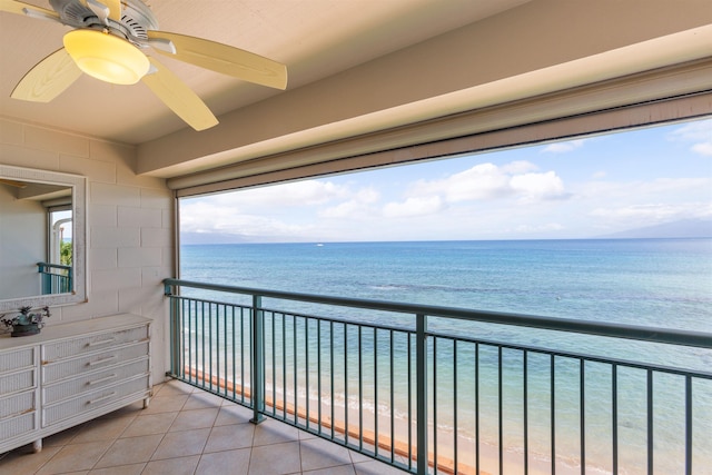 balcony with a beach view and a water view