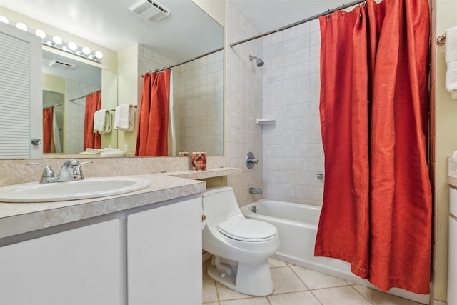 full bathroom featuring tile patterned floors, vanity, toilet, and shower / bath combo with shower curtain