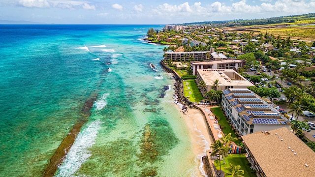 birds eye view of property with a view of the beach and a water view