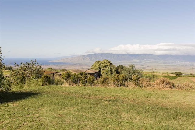 view of mountain feature with a rural view