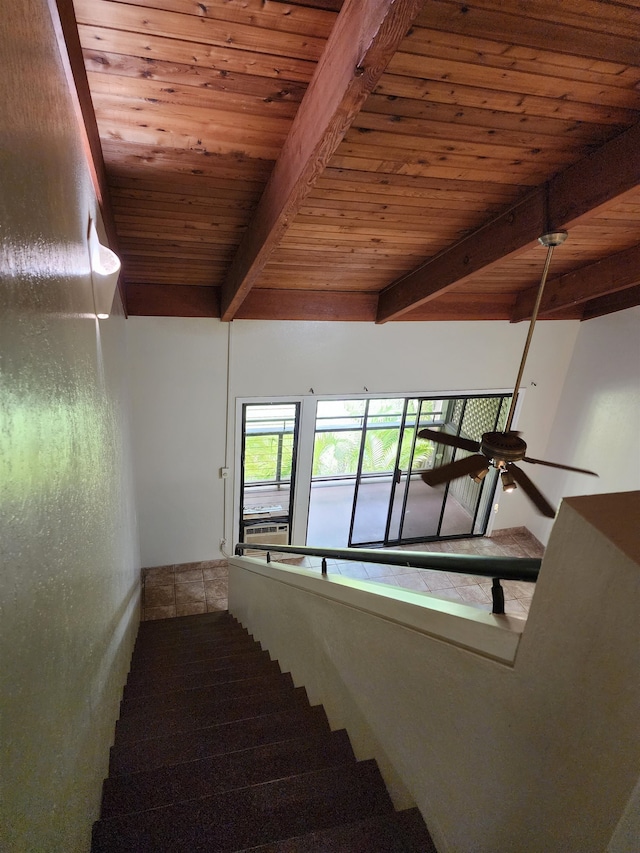 stairs with wood ceiling, beam ceiling, and ceiling fan