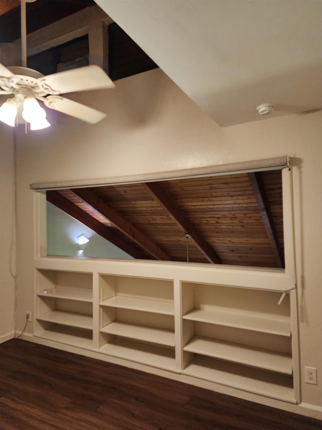 interior space with ceiling fan, vaulted ceiling with beams, dark hardwood / wood-style flooring, and wooden ceiling