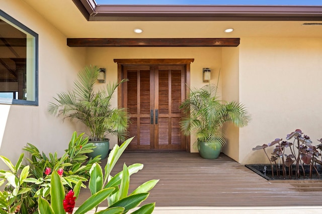 view of exterior entry featuring french doors