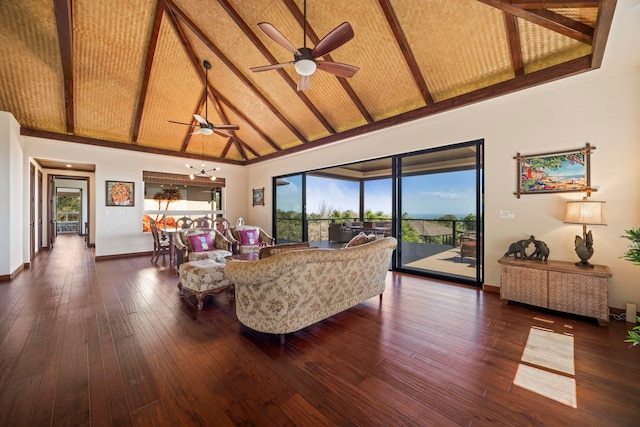 living room featuring ceiling fan, dark hardwood / wood-style flooring, high vaulted ceiling, and a healthy amount of sunlight