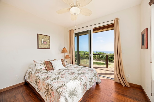 bedroom featuring ceiling fan, dark hardwood / wood-style floors, and access to outside