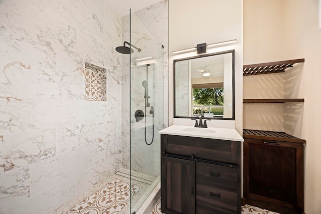 bathroom with vanity and tiled shower