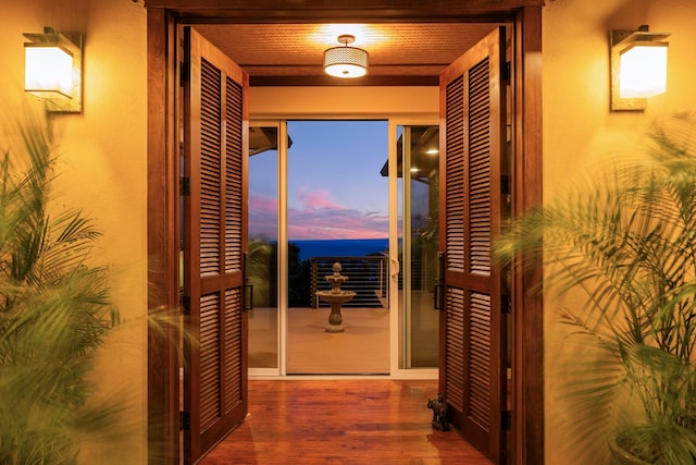 corridor featuring hardwood / wood-style floors and wood ceiling