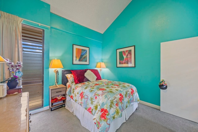 bedroom featuring carpet floors and lofted ceiling