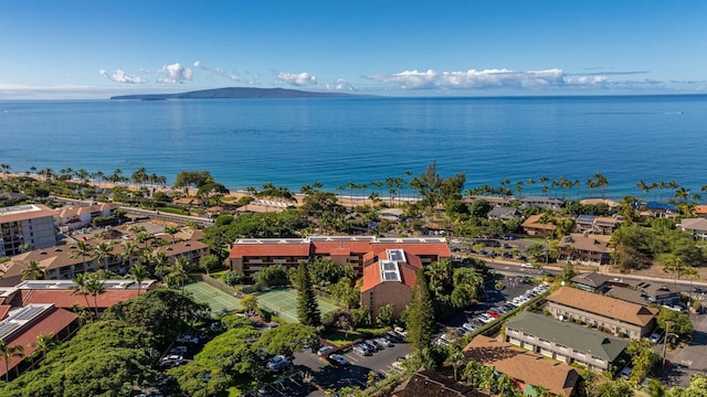 drone / aerial view featuring a water and mountain view