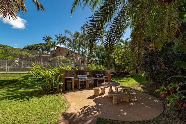 view of patio featuring area for grilling and exterior kitchen