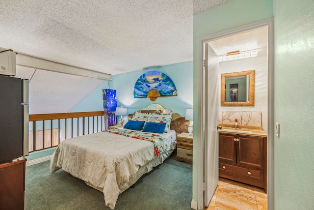 carpeted bedroom with vaulted ceiling with beams, stainless steel fridge, sink, and a textured ceiling