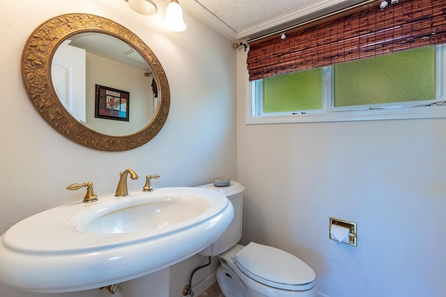 half bathroom with a sink and toilet