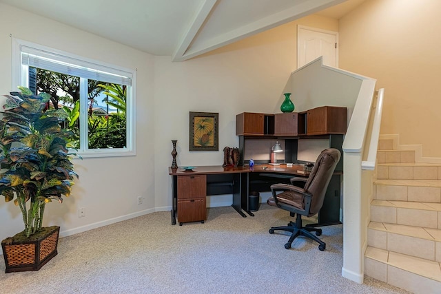 office area featuring baseboards, light carpet, and lofted ceiling with beams