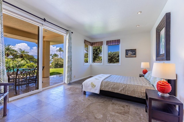 bedroom featuring stone tile floors, access to outside, baseboards, and recessed lighting