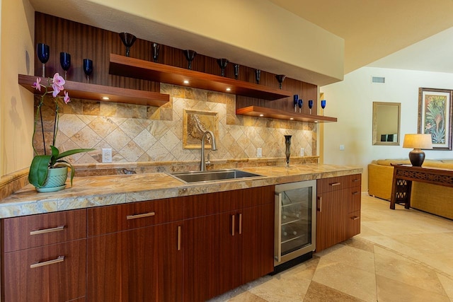 kitchen with a sink, wine cooler, open shelves, and backsplash