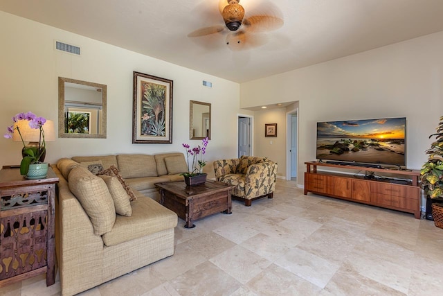 living room featuring ceiling fan and visible vents