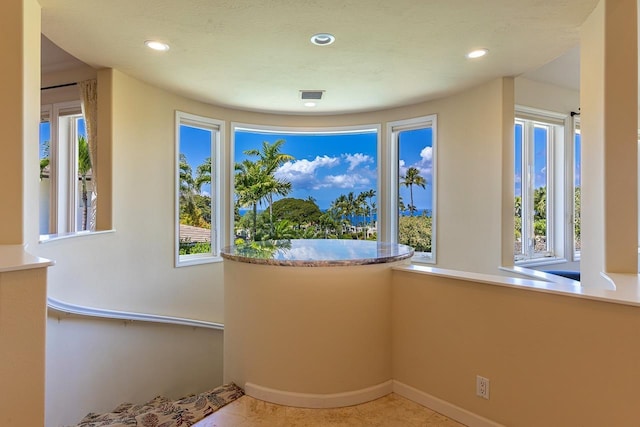 interior space with visible vents and recessed lighting