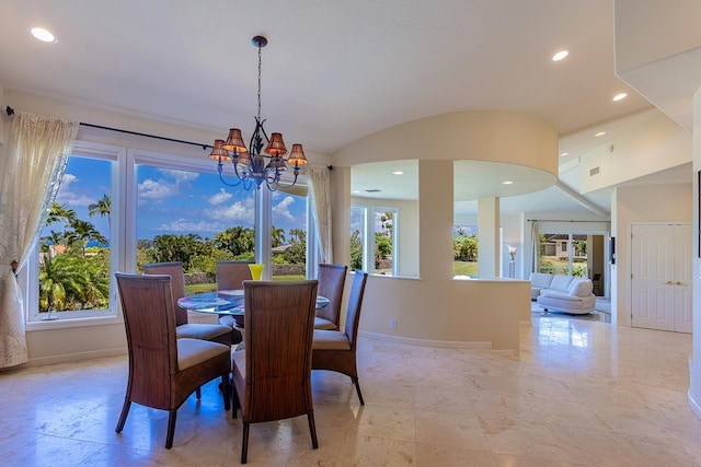 dining room with an inviting chandelier, baseboards, and recessed lighting