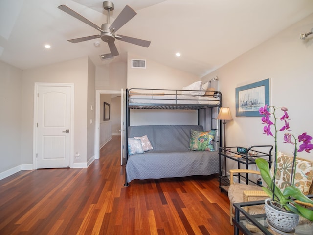 bedroom featuring ceiling fan, dark wood-type flooring, and vaulted ceiling