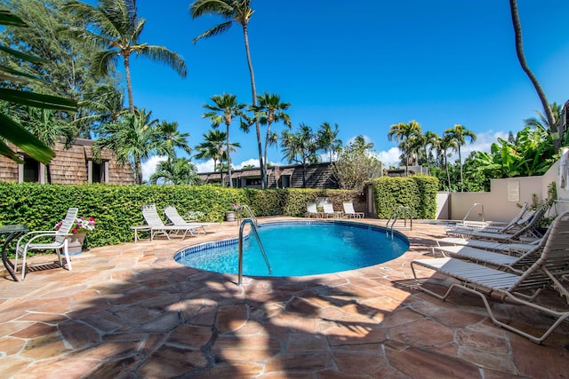 view of swimming pool featuring a patio