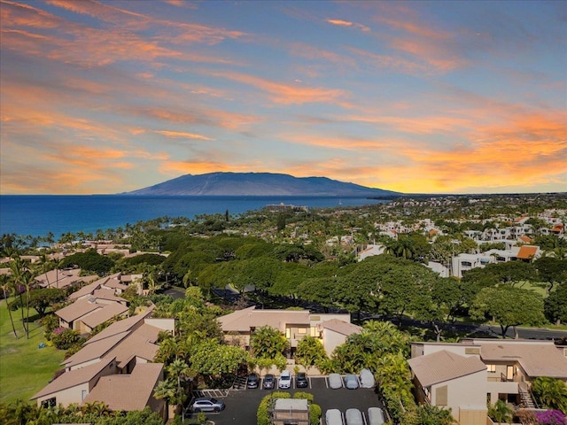 aerial view at dusk with a water and mountain view