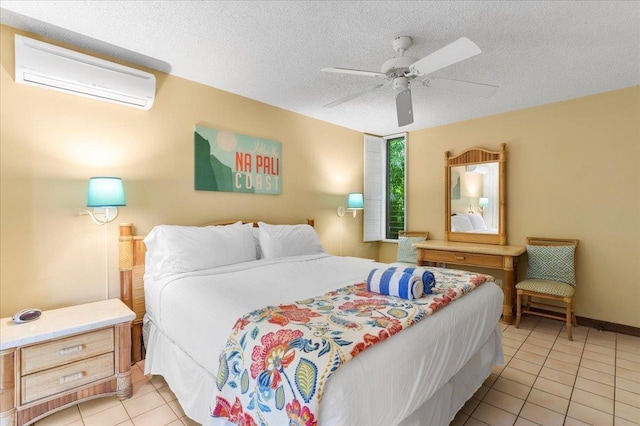 bedroom featuring a wall mounted AC, a textured ceiling, ceiling fan, and light tile patterned floors