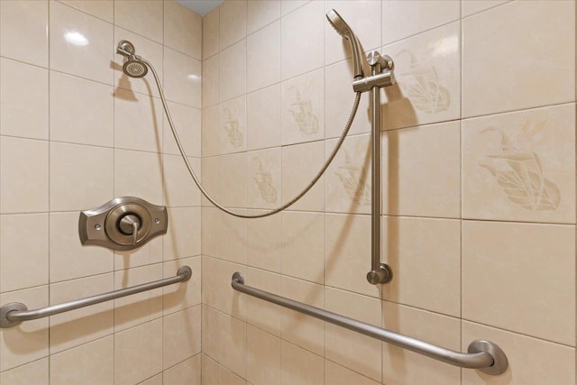 bathroom with tiled shower