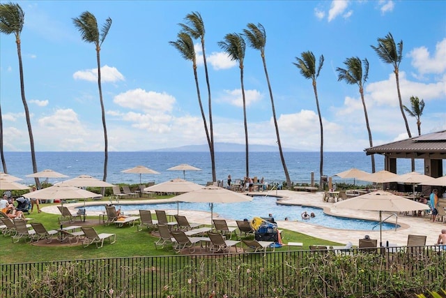 view of pool with a water view