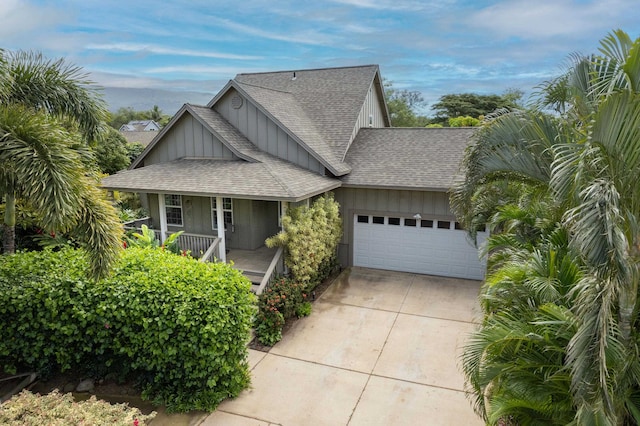 view of front of home with covered porch and a garage