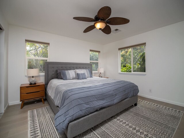 bedroom featuring ceiling fan and light hardwood / wood-style flooring