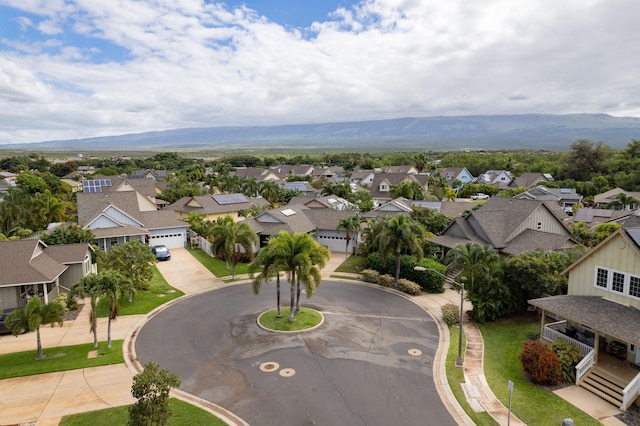 birds eye view of property with a mountain view